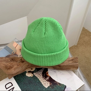 Detailed knit texture and vibrant green color of this cozy winter beanie hat