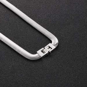 Close-up of silver flat snake chain showing the stainless steel fold-over clasp detail