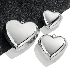 Polished heart pendant necklace in silver stainless steel with minimalist flat design