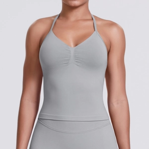 Detail of grey seamless sports camisole with halter straps and pleated chest texture