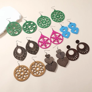 Collection of retro geometric hollow wooden earrings in various colors and floral patterns
