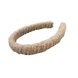 Minimalist beige lamb wool headband in soft plush material for women on white background
