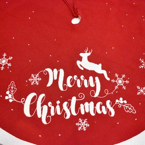 Red knitted Christmas tree skirt with Merry Christmas text, reindeer and snowflake patterns