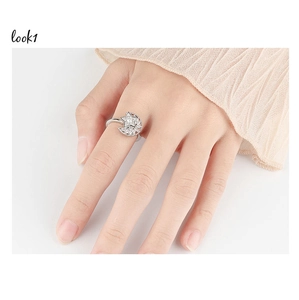 Detailed view of spinning star and moon ring with cubic zirconia on model's hand