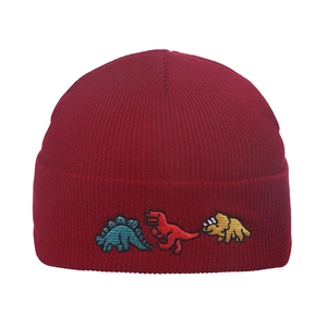 Close-up of three colorful dinosaur embroidery details on a dark red ribbed knit beanie