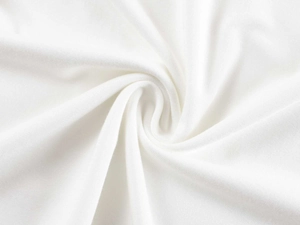 Close-up of premium white ribbed knit fabric showing soft texture and weave detail