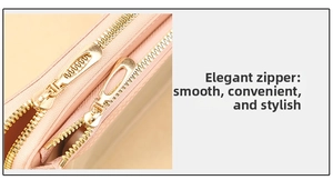 Detail of smooth gold double zippers on a pink textured faux leather crossbody bag