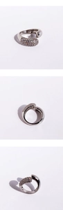 Detailed views of silver snake ring featuring pavé-set clear cubic zirconia stones