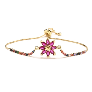 Elegant gold flower bracelet with colorful crystals and adjustable drawstring closure