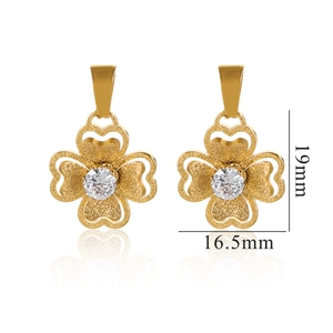 Macro shot of 18K gold plated clover pendants with frosted texture and zircon center