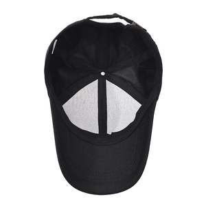 Black cotton baseball cap showing internal reinforced seams and adjustable metal buckle
