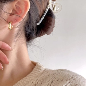 French style S925 sterling silver golden C-shaped hoop earrings worn by a model