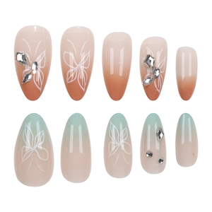 Almond butterfly press-on nails with macaron gradient and 3D rhinestones on white background