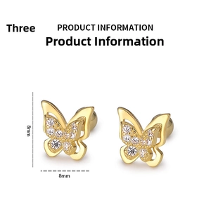 Detail view of 8mm golden butterfly screw-back earrings with sparkling rhinestones