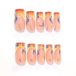 Détail de faux ongles carrés longs avec fleurs bleues et dégradé orange vif