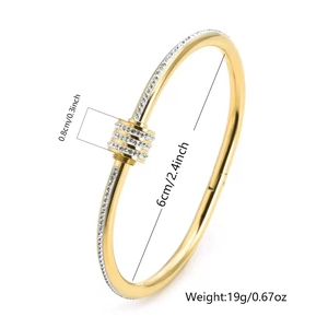 Detail view of gold titanium steel bangle with sparkling zircons and size measurements