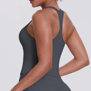 Detail view of charcoal grey racerback sports vest with moisture-wicking stretch fabric