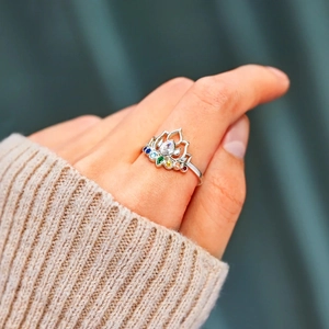 S925 sterling silver lotus ring with colorful rainbow zircons on a model's finger