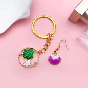 Colorful sea shell pendant keychain and earring set with starfish and pearls in gold finish