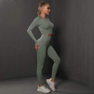 Detail of sage green seamless yoga set with thumbhole sleeves and high waist leggings