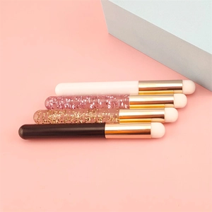 Detail of round head lip brushes with glitter handles and soft silicone sponge tips