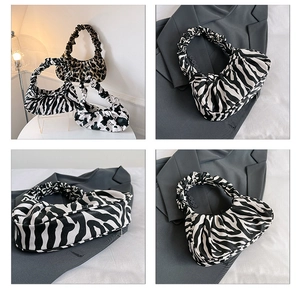 Collage of zebra print cloud bag with pleated details on gray blazer for chic styling