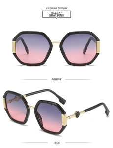 Detail view of geometric octagon sunglasses with black frames and gradient grey pink lenses