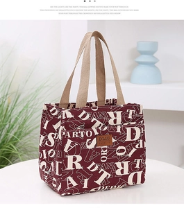 Détail du sac à déjeuner bordeaux en tissu oxford avec imprimé et étiquette en cuir