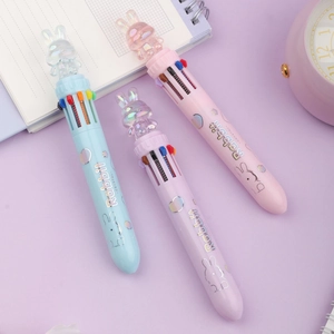 Close-up of cute rabbit crystal pens with 8-color refills on a stationery background