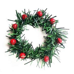 Christmas napkin ring with green pine needles and red berries for festive table decor