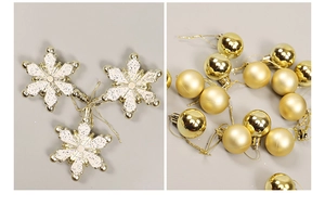 Close-up of golden snowflake and ball ornaments with glitter and matte finishes