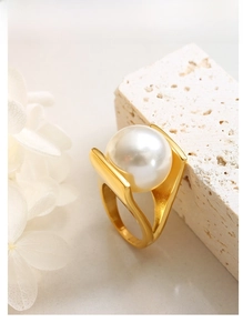 Detail of Y-shaped gold-plated stainless steel ring with a large white pearl on stone