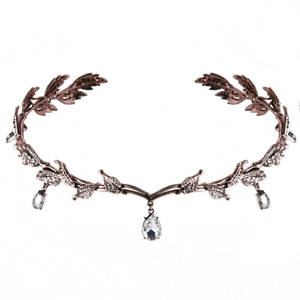 Macro detail of rose gold leaf bridal tiara with sparkling crystal drop pendants
