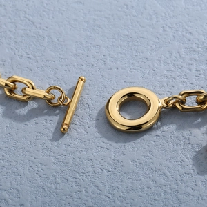 Polished 18K gold stainless steel chain bracelet featuring a classic OT toggle clasp