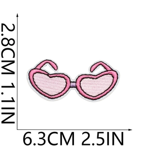 Detail view of heart-shaped glasses embroidery patch with size measurements in cm and inches
