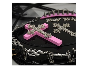 Detail of heart bag with metal cross, Baby logo, spikes and flame chain links