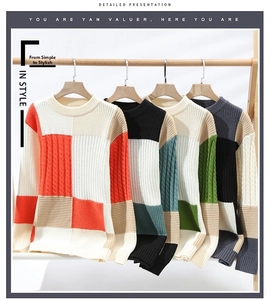 Detail of color-block crew neck knit sweaters with ribbed cuffs in multiple colorways