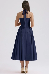 Back view of a navy blue halter neck summer dress with an elegant open back design