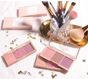 Detailed macro shot of the three-color matte blush palette with vintage rose lid design