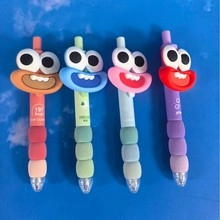 Set of 4 colorful cartoon retractable pens with silicone grips and eye decorations