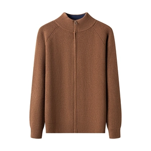 Detail of brown knitted cardigan featuring a full zipper and vertical ribbed texture