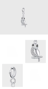 Macro detail of 925 sterling silver owl pendant with hand-set 5A cubic zirconia crystals