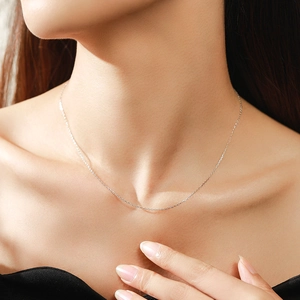 Elegant S925 sterling silver heart snake chain necklace on a female model's collarbone