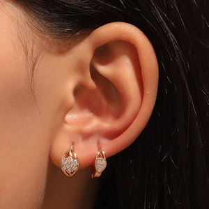 Elegant rose gold huggie earrings with sparkling crystals and teardrop hollow design