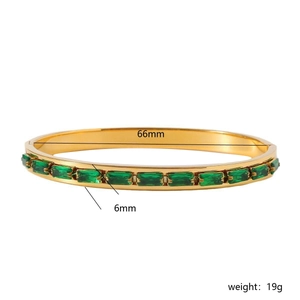 Golden bangle with rectangular green gemstones featuring 66mm diameter and 6mm width