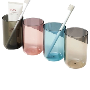 Four-piece minimalist translucent mouthwash cups in grey, pink, blue, and champagne gold