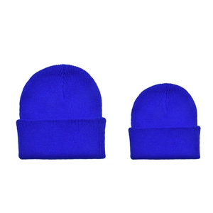 Detail of royal blue ribbed knit beanies in parent-child set with folded cuff design