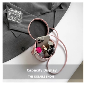 Top view of pink bucket bag showing interior storage capacity for phone and cosmetics
