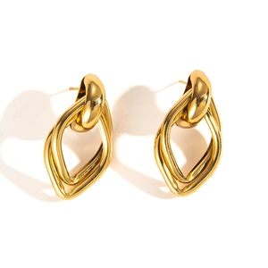 Detailed view of polished golden interlocking twisted knot earrings with mirror finish