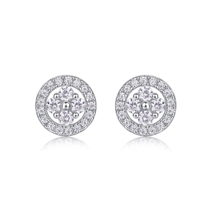Macro shot of silver stud earrings with a four-prong setting and sparkling round zircons